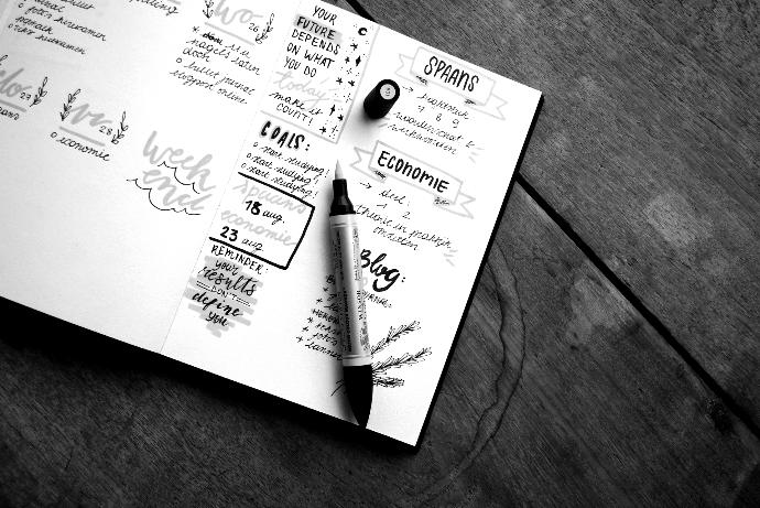 black and gray pen on table